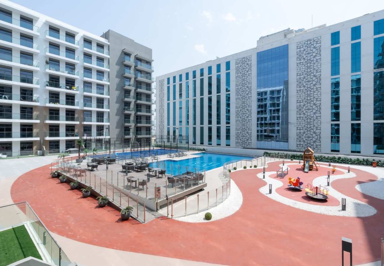 Ferienwohnung in Dubai - Charming Pool View | Vibrant and Tranquil 1BR